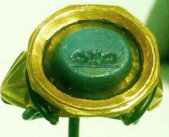Gold finger ring with an engraved intaglio showing two mice. Possibly referencing the story of the town mouse and the country mouse.